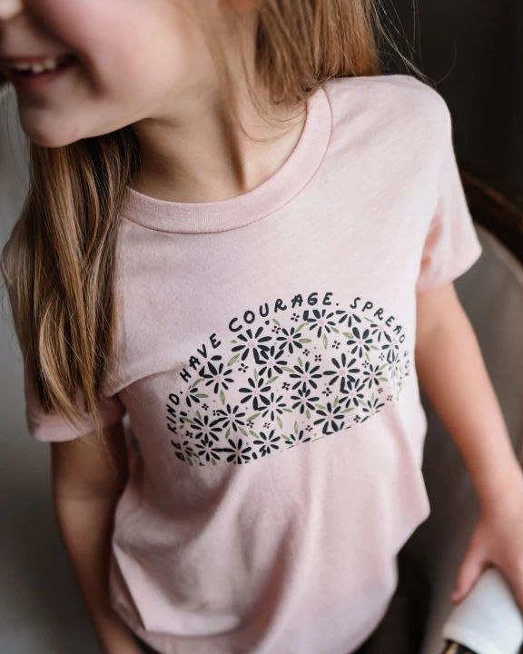 BE KIND. HAVE COURAGE. SPREAD JOY. KIDS TEE IN PEACH