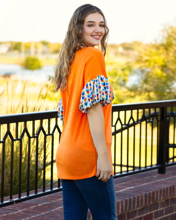 30012 - Orange Top with Geometric Balloon Sleeves